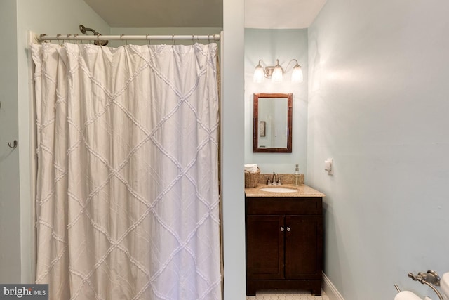 bathroom with vanity and walk in shower