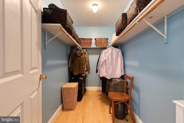 spacious closet featuring hardwood / wood-style flooring