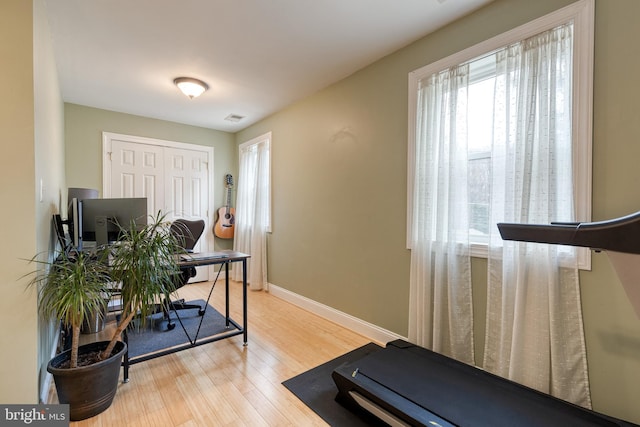 exercise area featuring light hardwood / wood-style floors