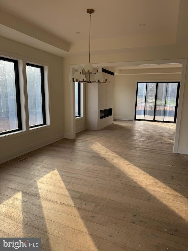 unfurnished living room with light hardwood / wood-style floors