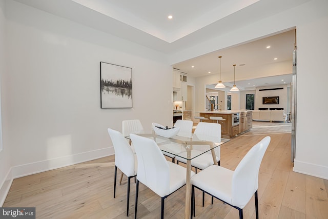 dining space featuring light hardwood / wood-style flooring