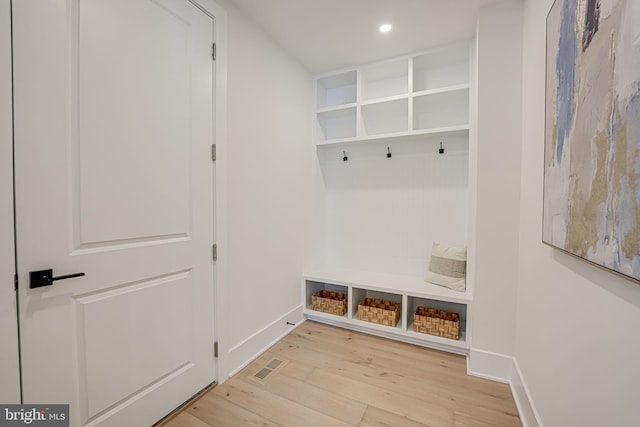 mudroom with light hardwood / wood-style flooring