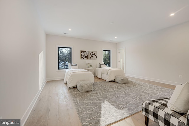 bedroom with light hardwood / wood-style floors