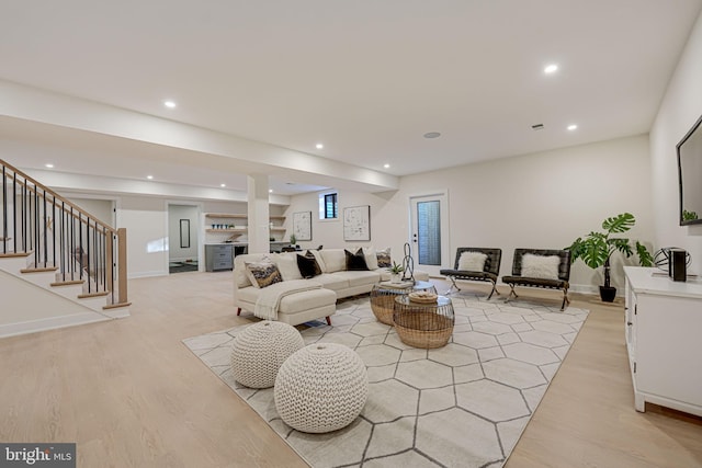 living room with light hardwood / wood-style flooring