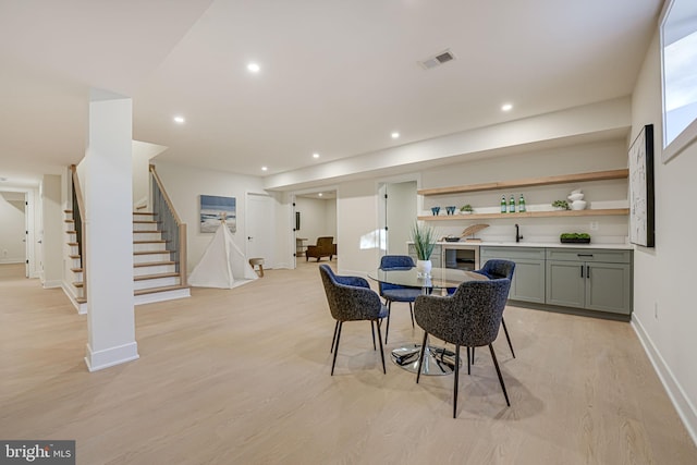 dining room with light hardwood / wood-style flooring