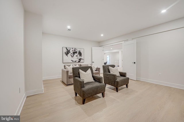 sitting room featuring light wood-type flooring