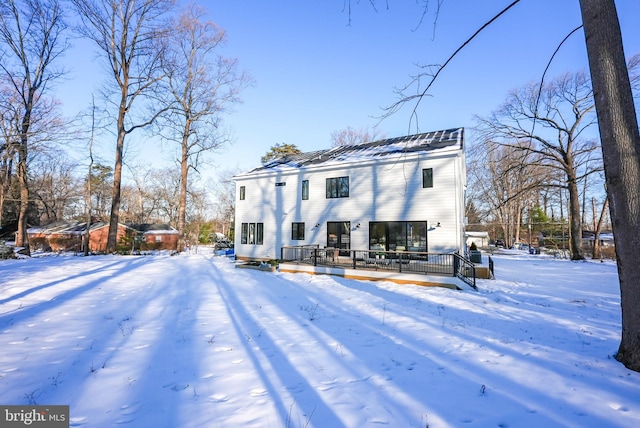 view of snow covered house