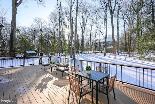 view of snow covered deck