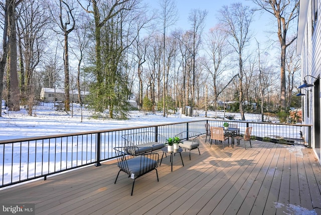 view of snow covered deck