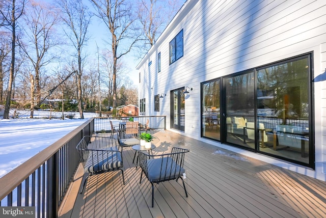 view of snow covered deck