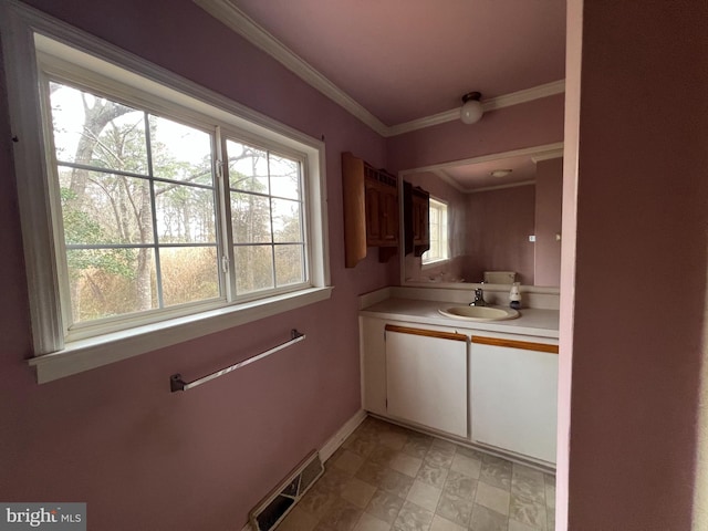 bathroom with vanity and ornamental molding