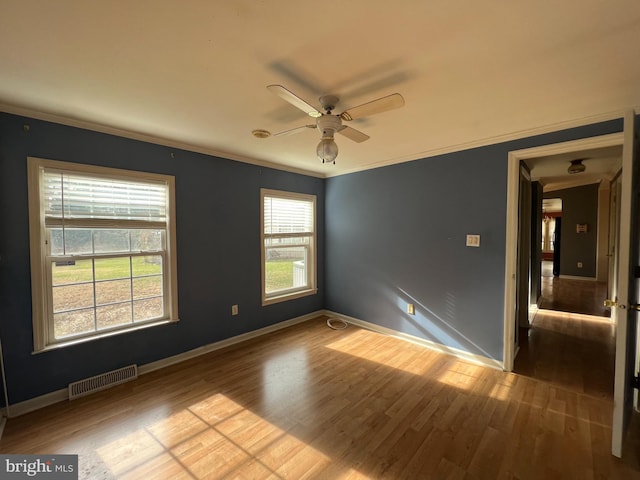 unfurnished room featuring crown molding, ceiling fan, and hardwood / wood-style flooring