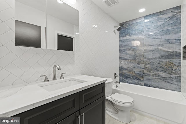 full bathroom with vanity, toilet, tile walls, and bathing tub / shower combination