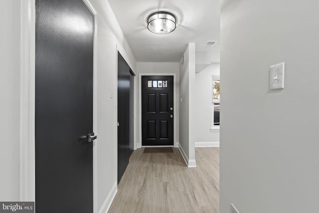 entryway with light hardwood / wood-style floors