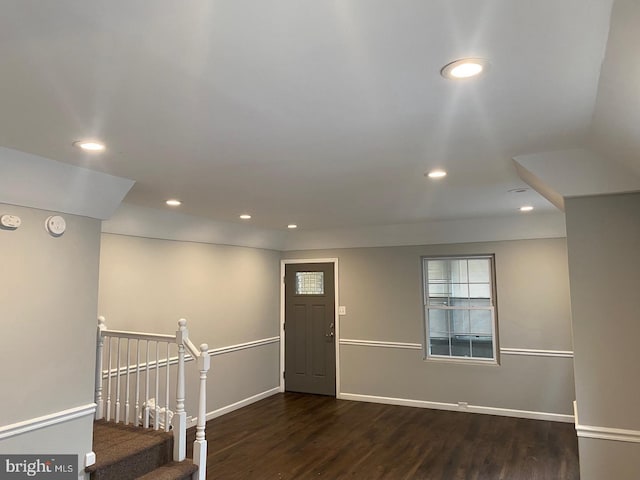 entryway with dark hardwood / wood-style flooring