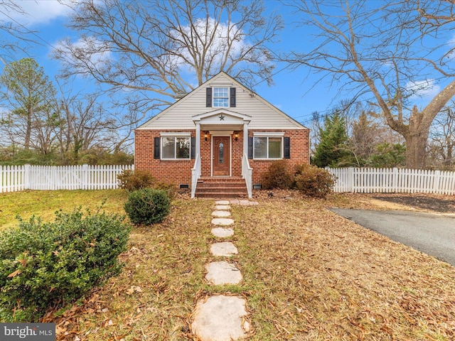 bungalow-style home featuring a front lawn