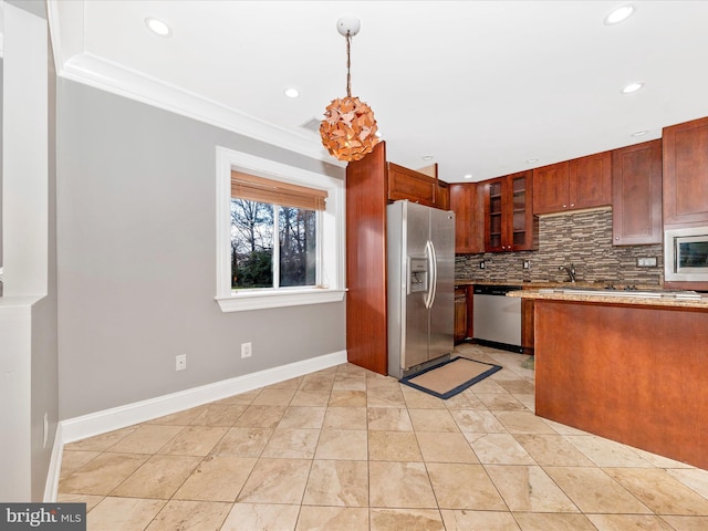 kitchen featuring crown molding, hanging light fixtures, decorative backsplash, light tile patterned floors, and appliances with stainless steel finishes