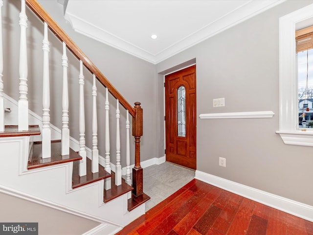 foyer featuring hardwood / wood-style floors and ornamental molding