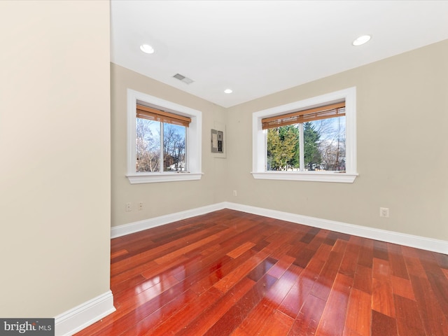 unfurnished room featuring hardwood / wood-style flooring and plenty of natural light