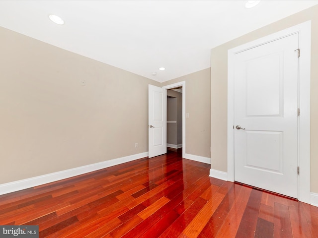 unfurnished bedroom featuring hardwood / wood-style flooring