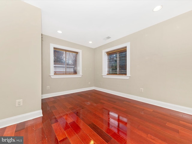 unfurnished room featuring hardwood / wood-style floors