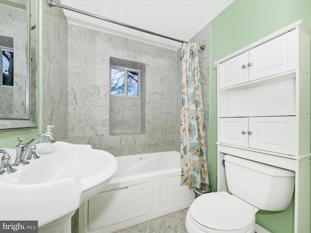 full bathroom featuring shower / bath combo, toilet, and sink