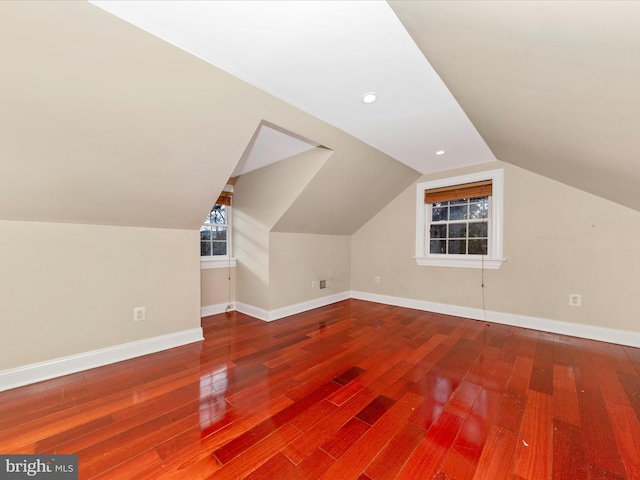 bonus room featuring wood-type flooring and lofted ceiling