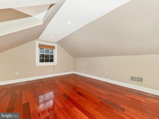 bonus room featuring hardwood / wood-style floors and vaulted ceiling