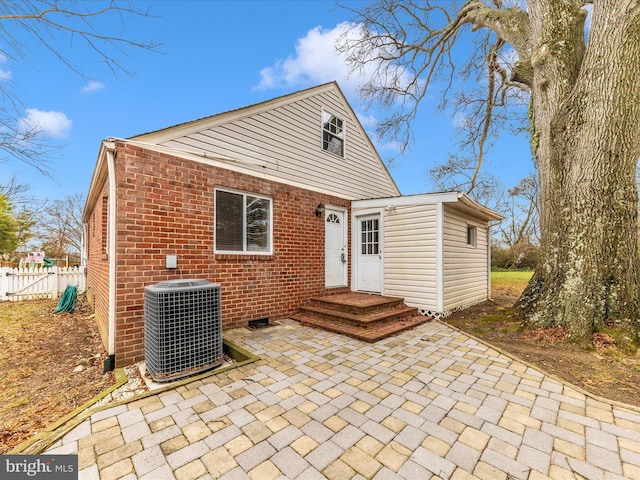 back of property featuring a patio and central AC unit