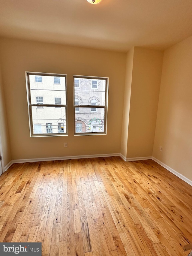 unfurnished room featuring light wood-type flooring