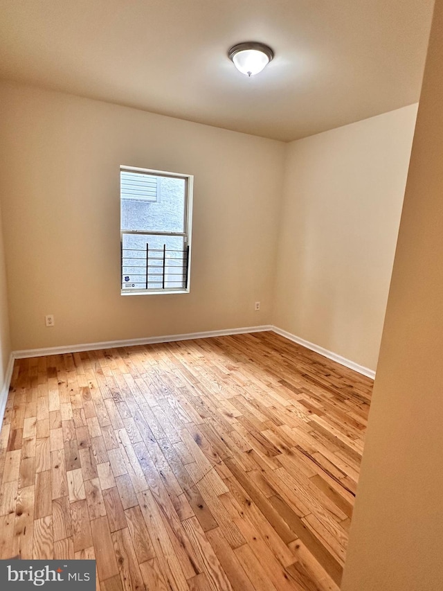 empty room with light wood-type flooring