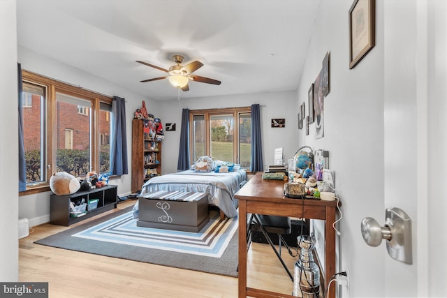 bedroom featuring ceiling fan and light hardwood / wood-style floors