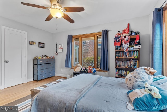 bedroom featuring ceiling fan and light wood-type flooring