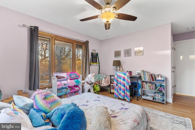 bedroom featuring hardwood / wood-style flooring and ceiling fan