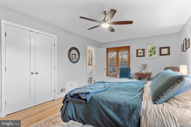 bedroom with wood-type flooring, a closet, ceiling fan, and ensuite bathroom