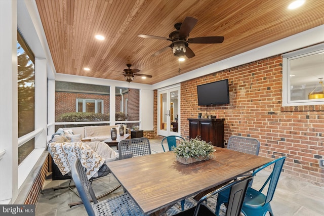 sunroom featuring ceiling fan, wooden ceiling, and french doors