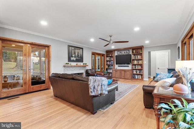 living room with french doors, light hardwood / wood-style floors, ceiling fan, and ornamental molding