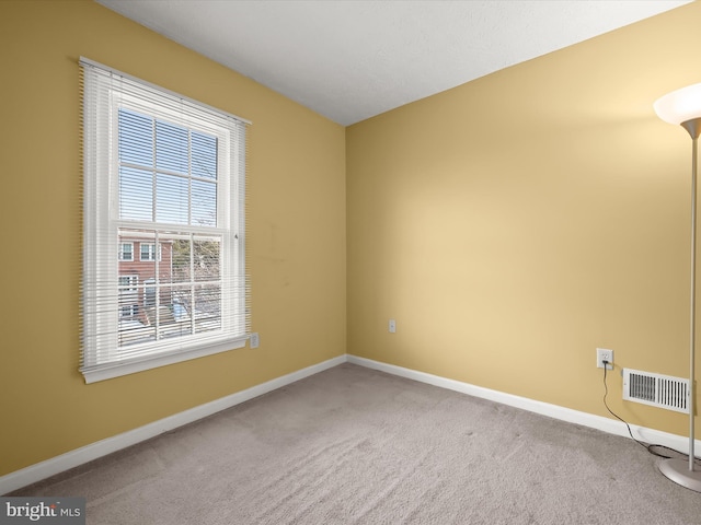 unfurnished room featuring carpet flooring