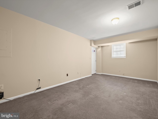 empty room featuring dark colored carpet