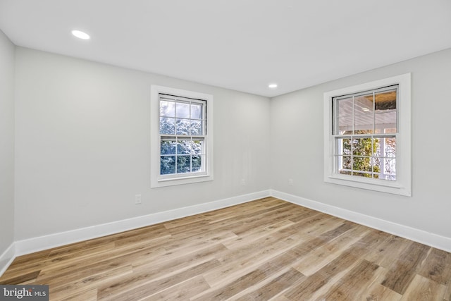 spare room featuring light hardwood / wood-style floors