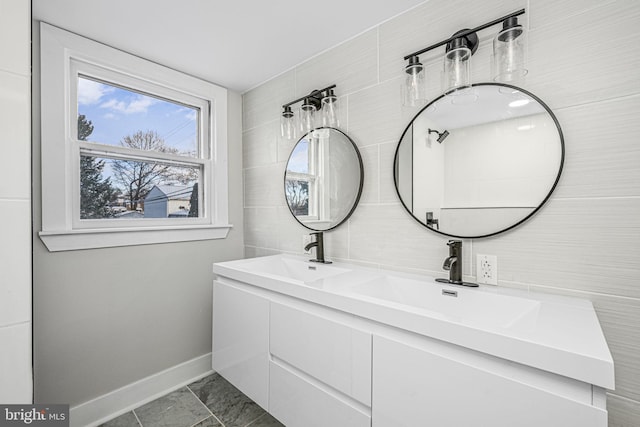 bathroom featuring tile patterned floors, vanity, and tile walls