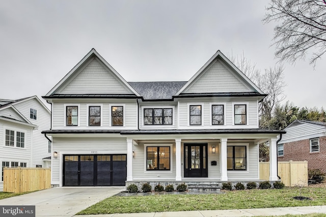 modern farmhouse style home featuring covered porch and a garage