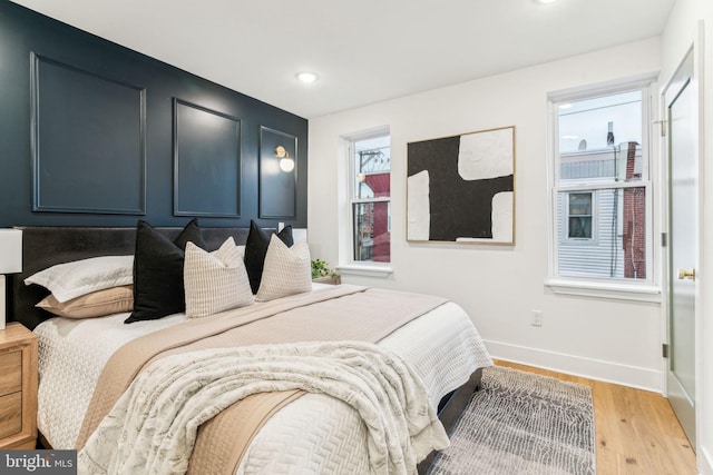 bedroom with light hardwood / wood-style flooring