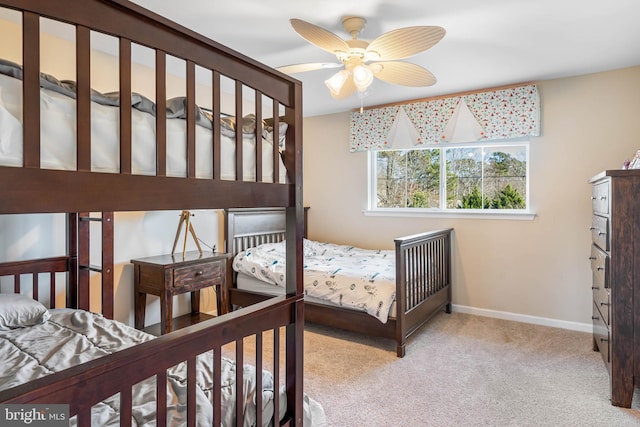 bedroom featuring ceiling fan and light carpet