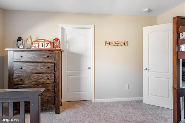 bedroom with light carpet