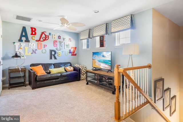 living room with carpet and ceiling fan