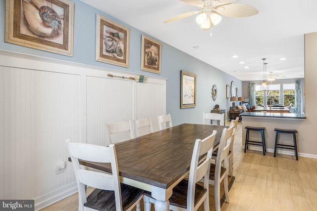 dining room featuring light wood-type flooring and ceiling fan