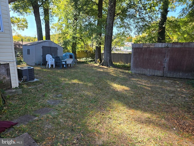 view of yard with a storage unit and central AC