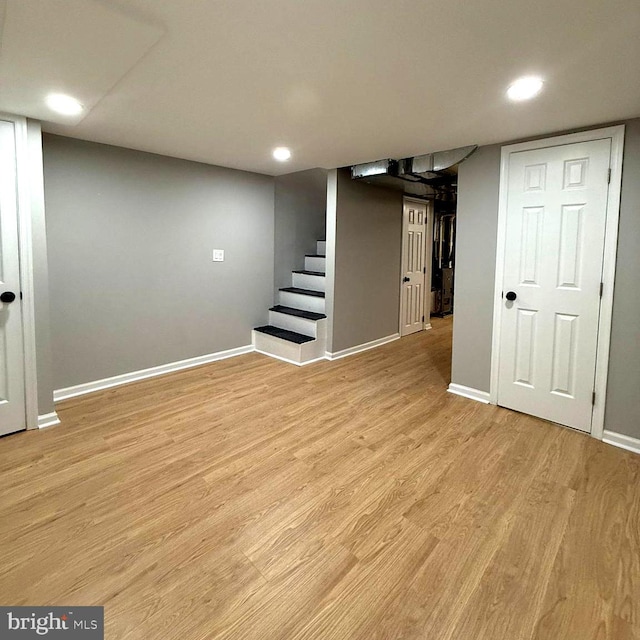 basement featuring light hardwood / wood-style floors