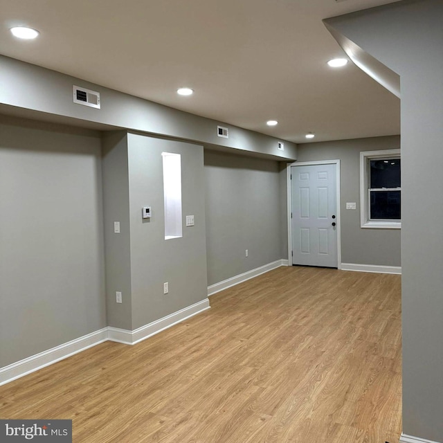 basement with light wood-type flooring